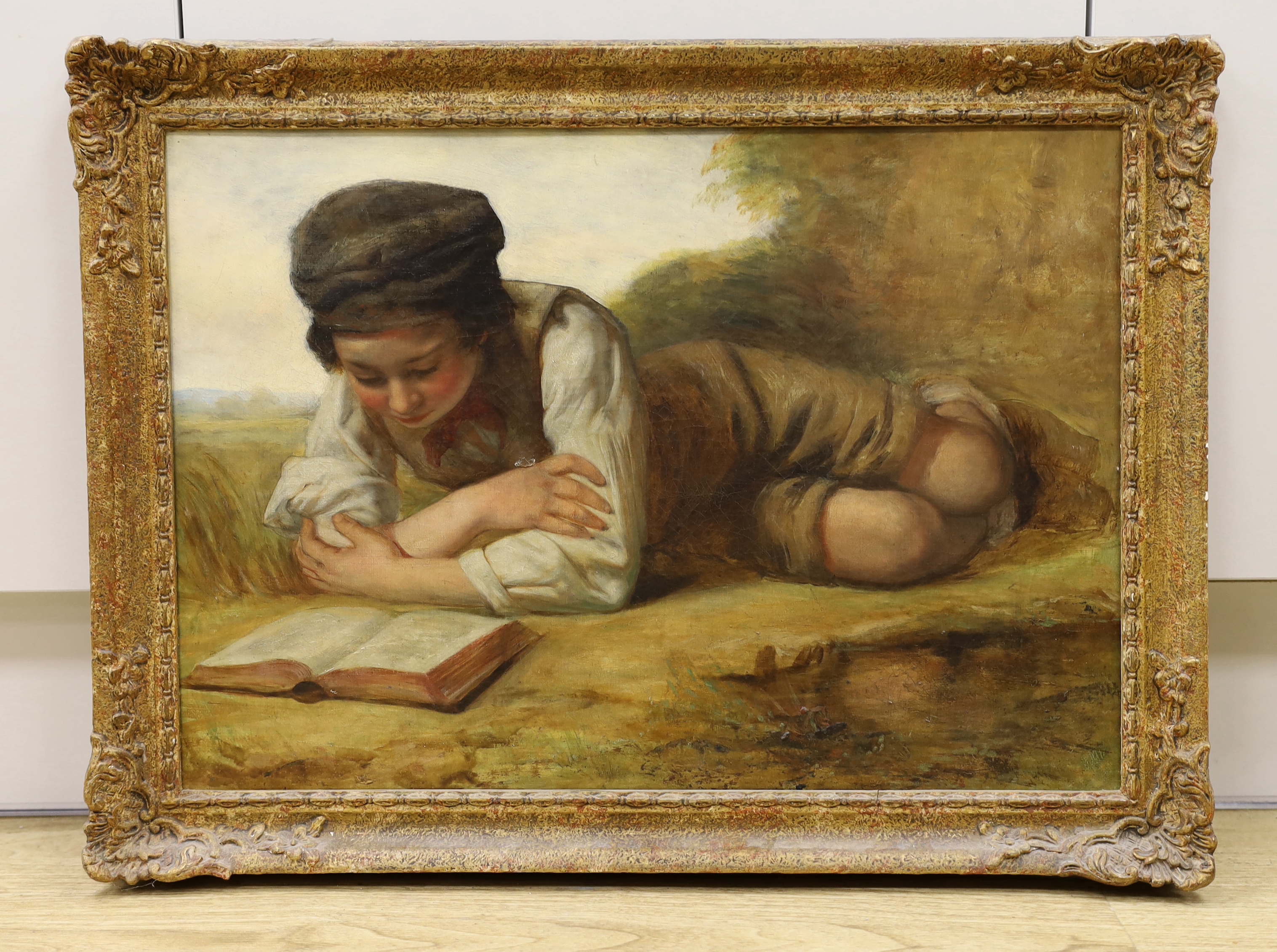 Charlie Compton (1828-1884), oil on canvas, Boy reading a book before a landscape, inscribed verso, 52 x 37cm